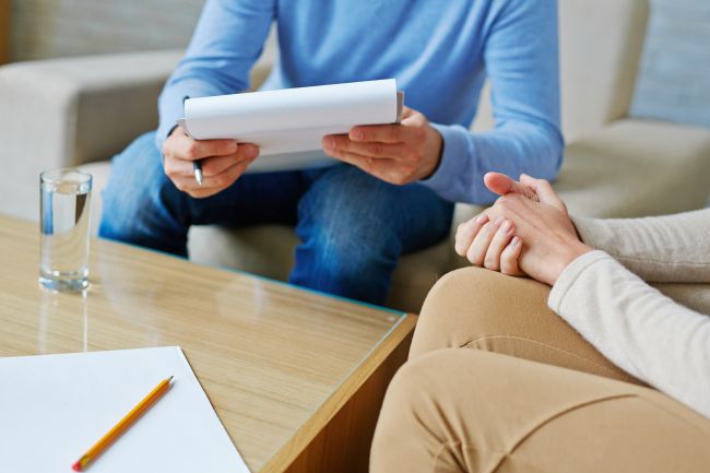 clinical psychologist working with a patient