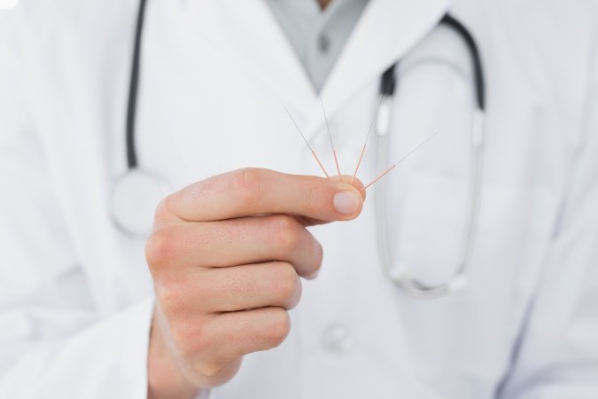 Medical Acupuncturist with acupuncture needles